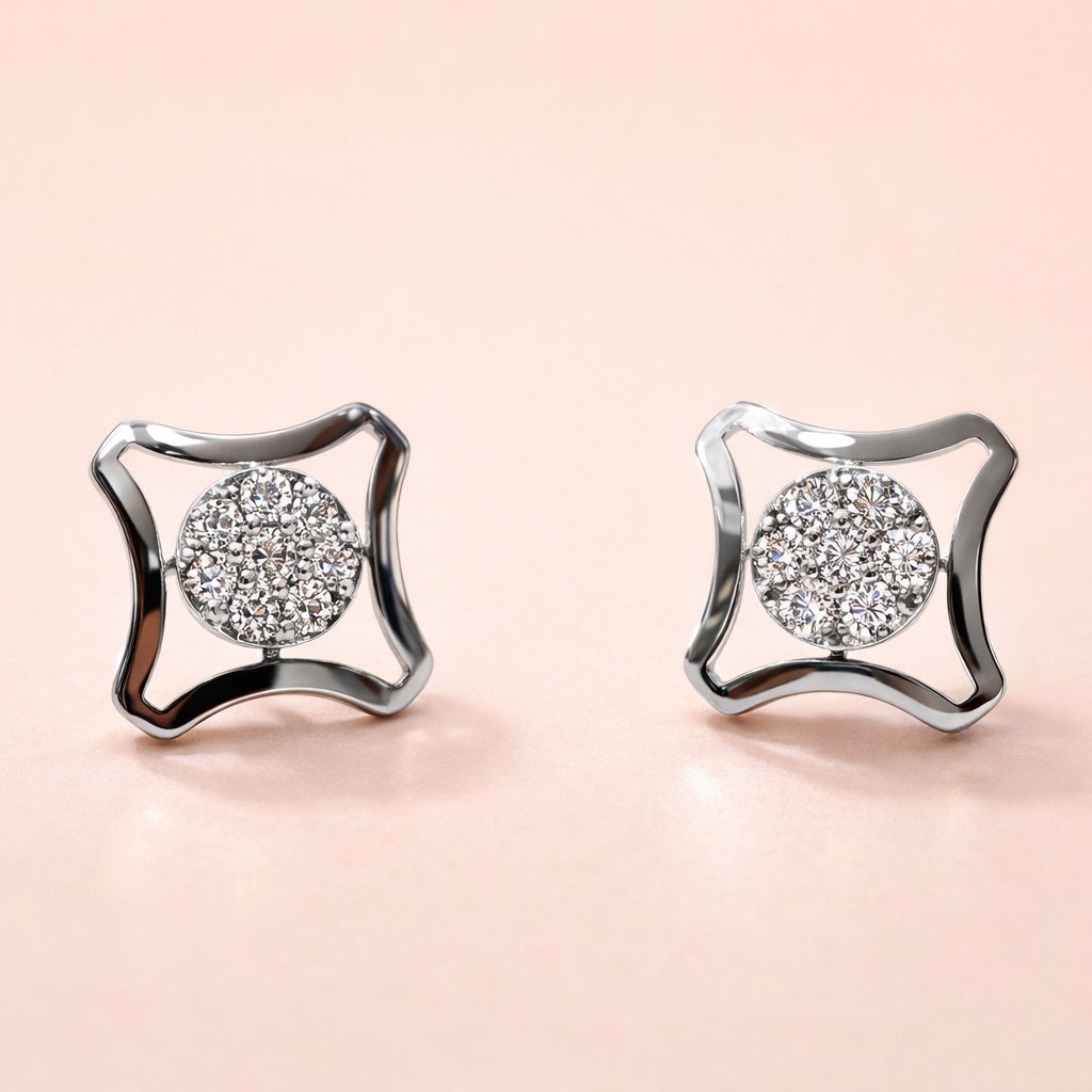 Pair of silver AD Earrings for Women with round gemstones on a light pink background