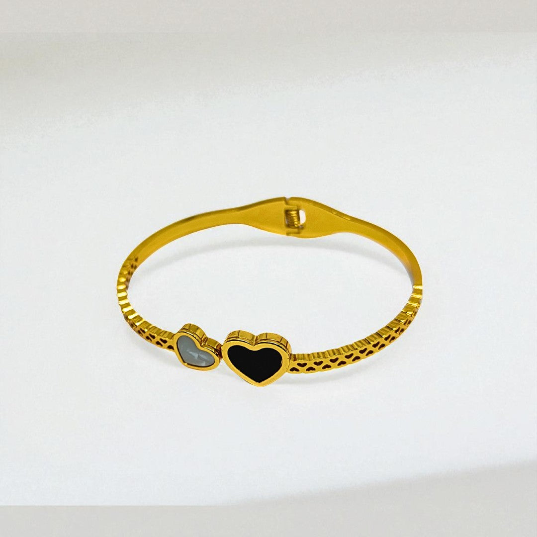 Gold Bracelet for Women with heart-shaped charms on a white background