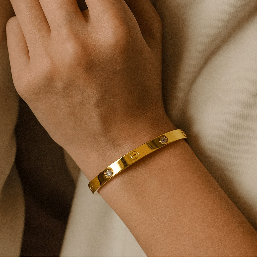 Gold Bracelet for Women on a wrist with a neutral background
