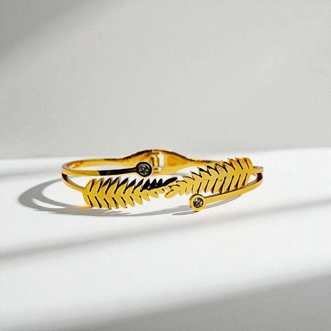 Gold Bracelet for Women on a light gray background