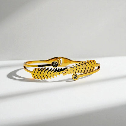 Gold Bracelet for Women on a light gray background