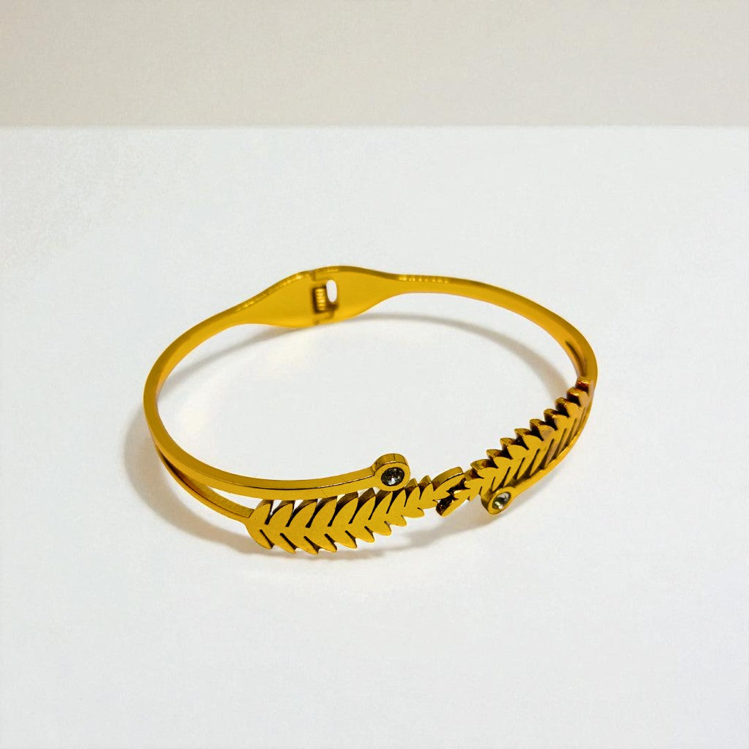 Gold Bracelet for Women on a light gray background