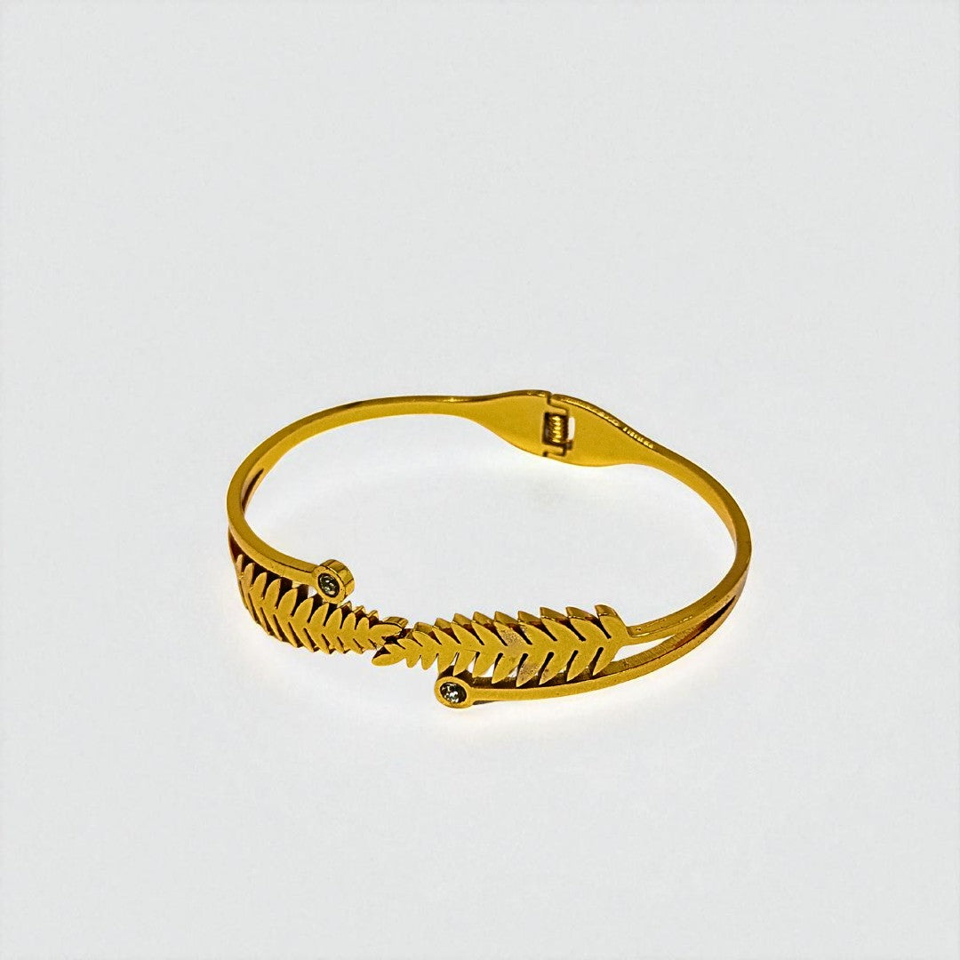 Gold Bracelet for Women on a light gray background