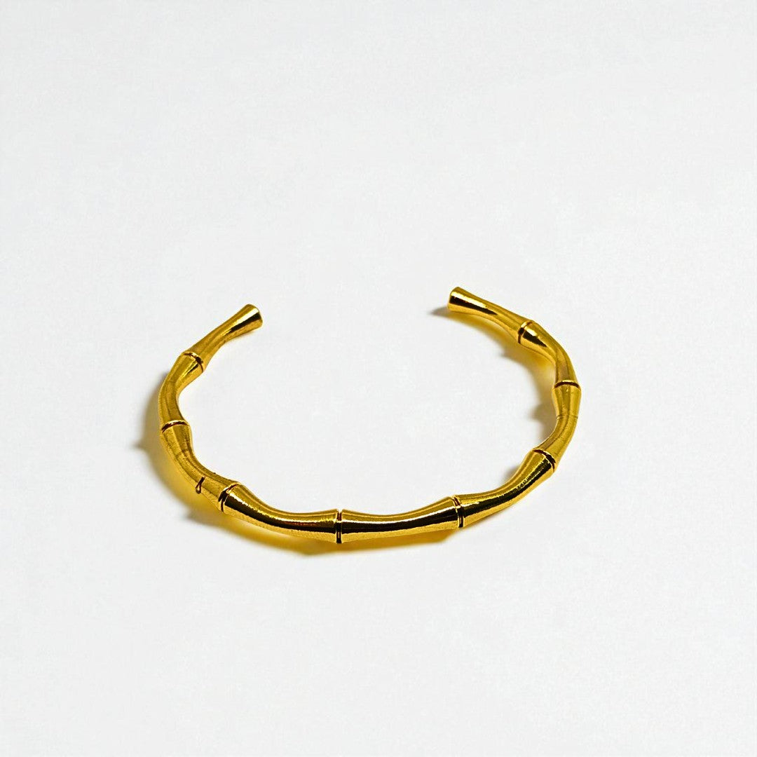 Gold Bracelet for Women on a light gray background