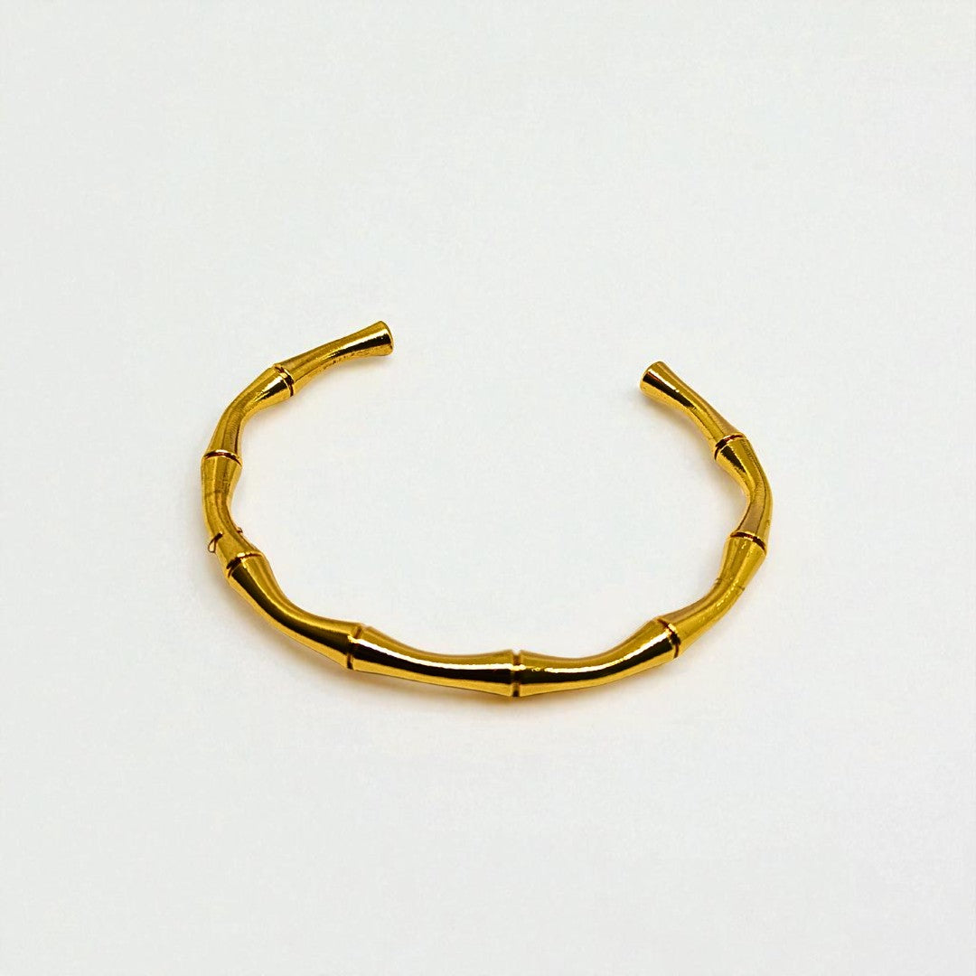 Gold Bracelet for Women on a light gray background