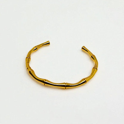 Gold Bracelet for Women on a light gray background