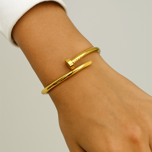 Gold Bracelet for Women on a wrist against a neutral background