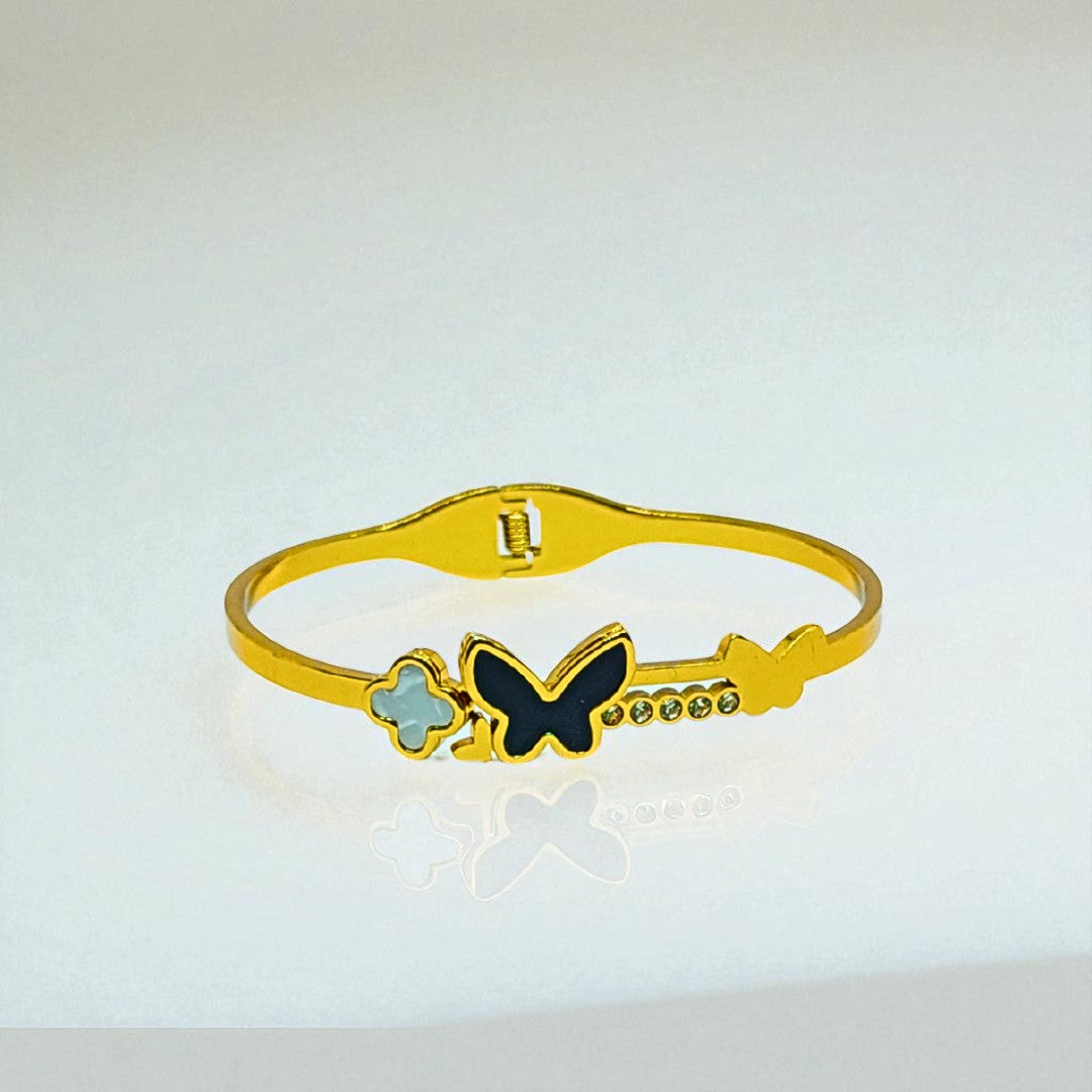 Gold Bracelet for Women with a butterfly design on a light gray background