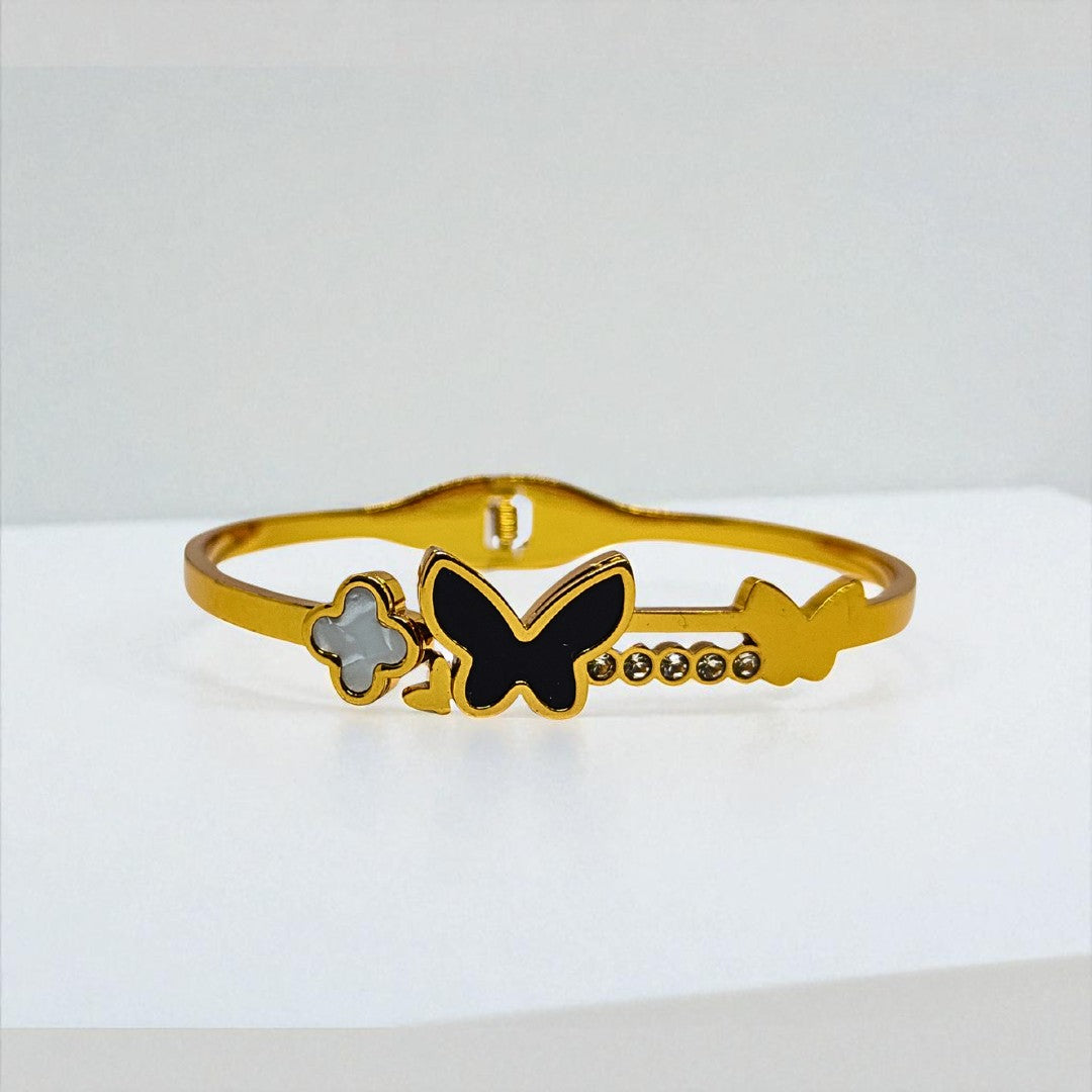 Gold Bracelet for Women with a black butterfly design on a white background
