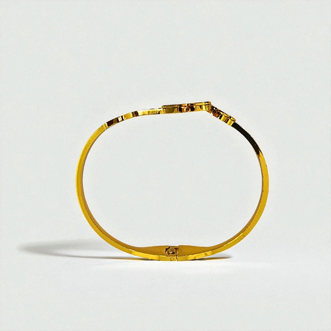 Gold Bracelet for Women on a light gray background