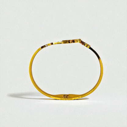 Gold Bracelet for Women on a light gray background