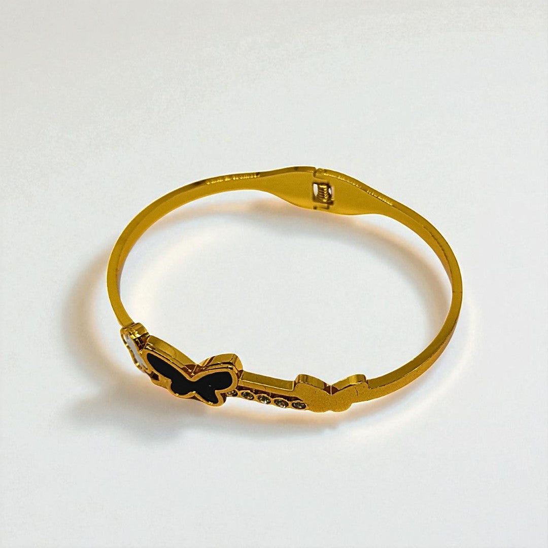 Gold Bracelet for Women with butterfly design on a white background