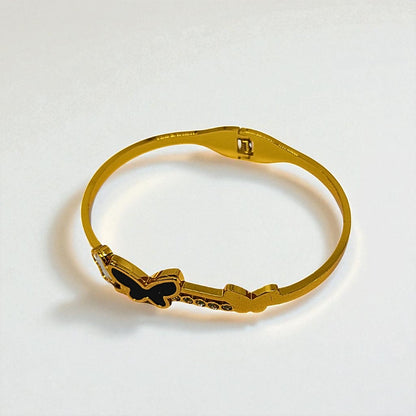 Gold Bracelet for Women with butterfly design on a white background