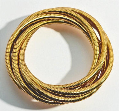 Gold Bracelet for Women on a wrist with a neutral background