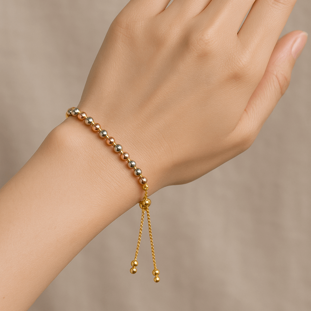 Gold Bracelet for Women on a hand against a neutral background