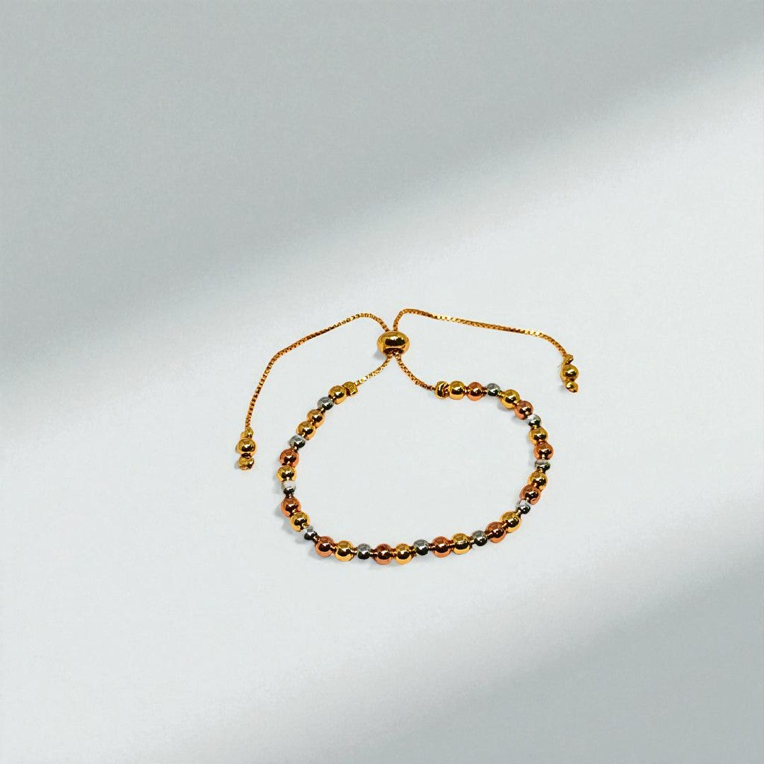 Gold beaded Bracelet for Women on a light gray background