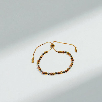 Gold beaded Bracelet for Women on a light gray background
