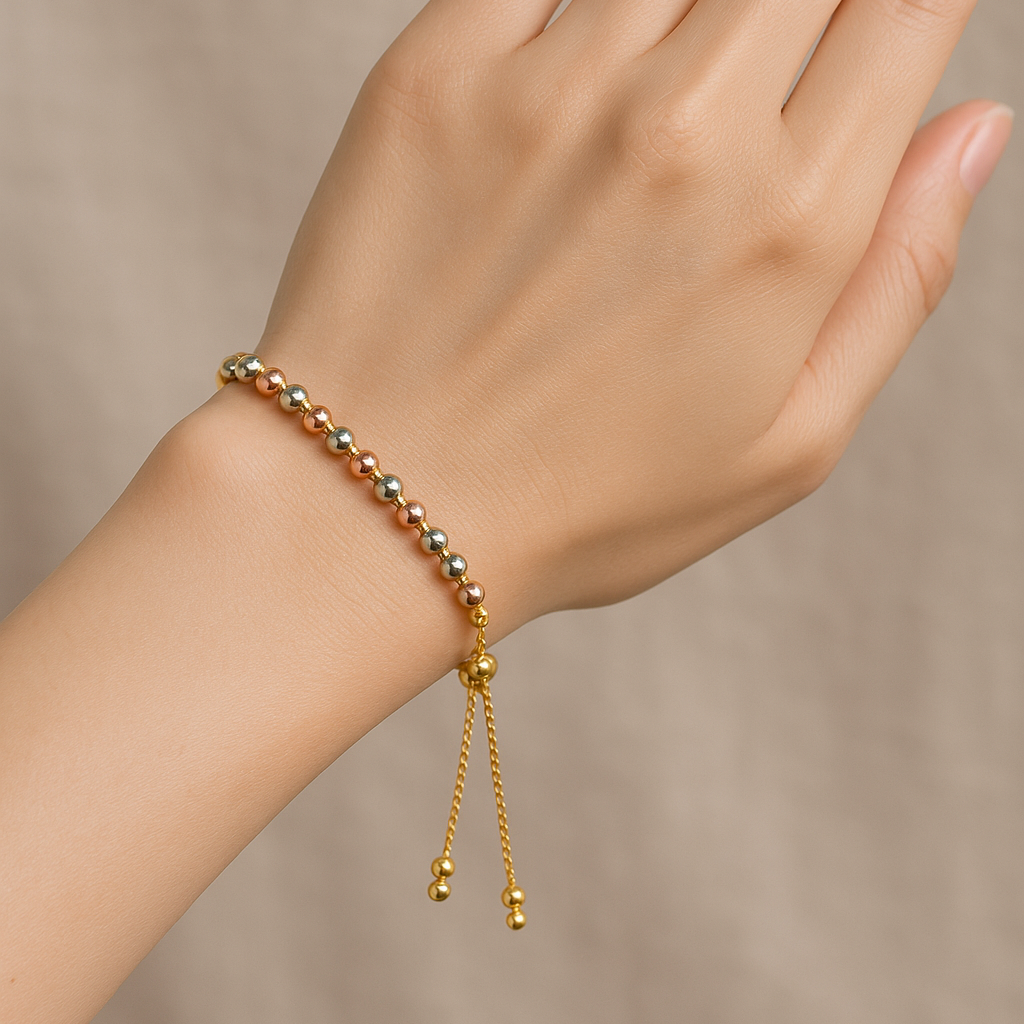 Gold Bracelet for Women on a hand against a neutral background