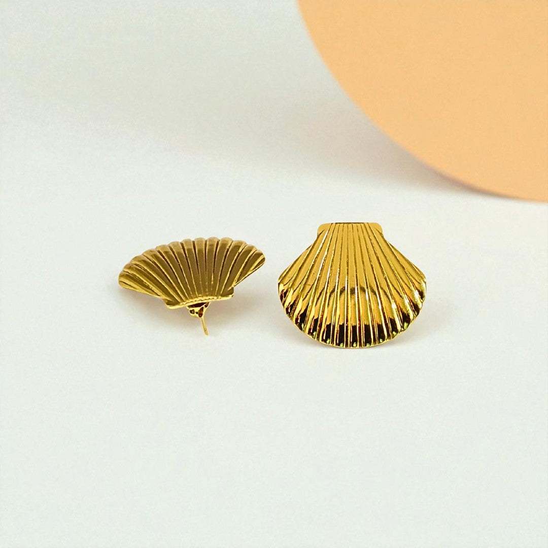 Gold shell-shaped Earrings for Women on a light background