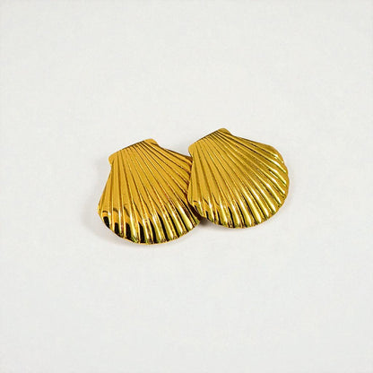 Gold shell-shaped Earrings for Women on a light gray background