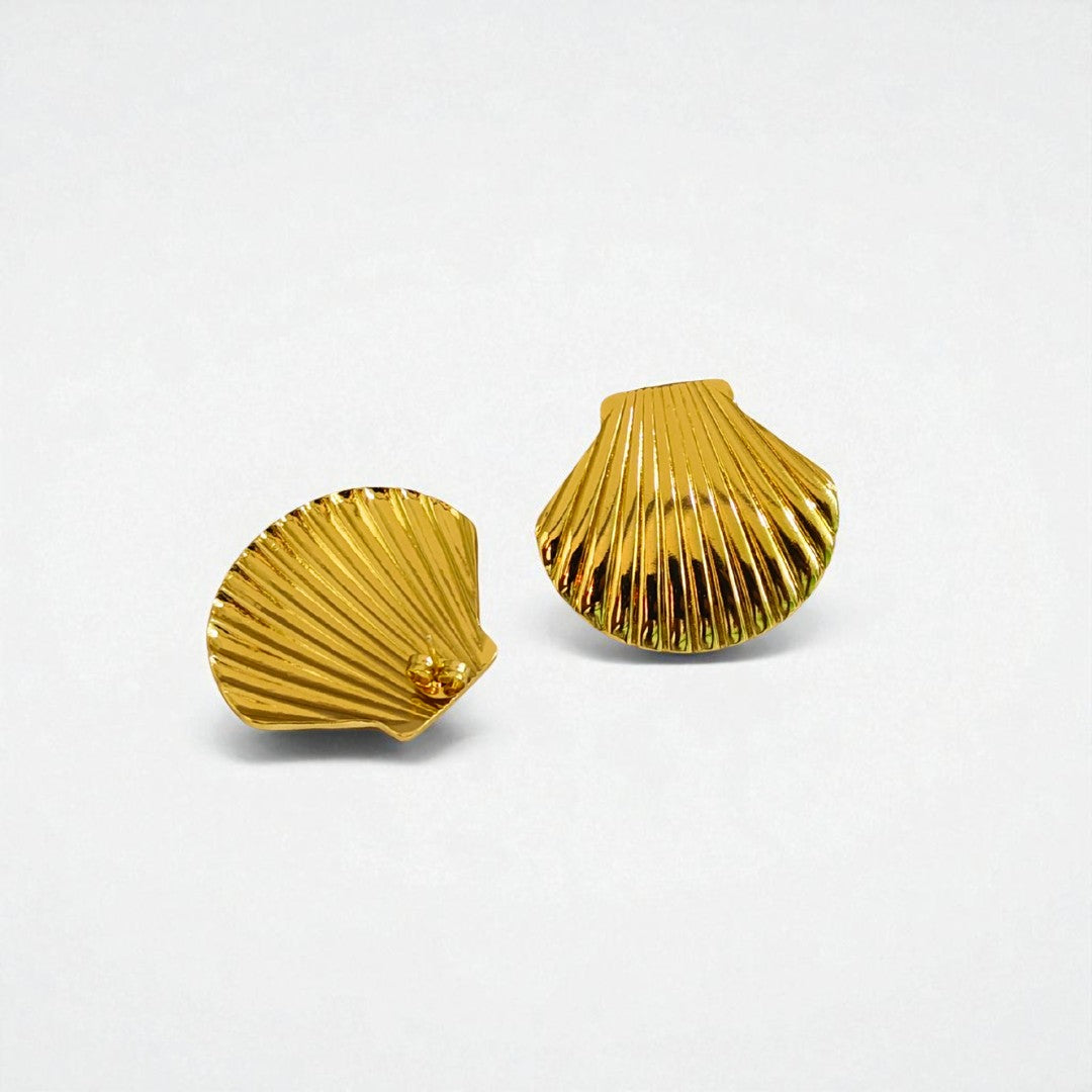 Gold scallop shell Earrings for Women on a light gray background