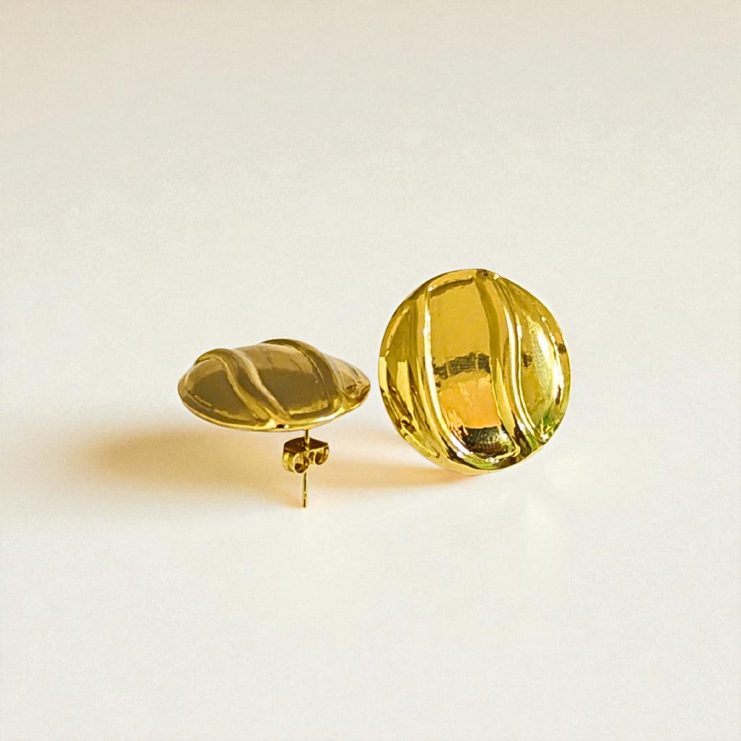 Pair of yellow Earrings for Women on a light beige background