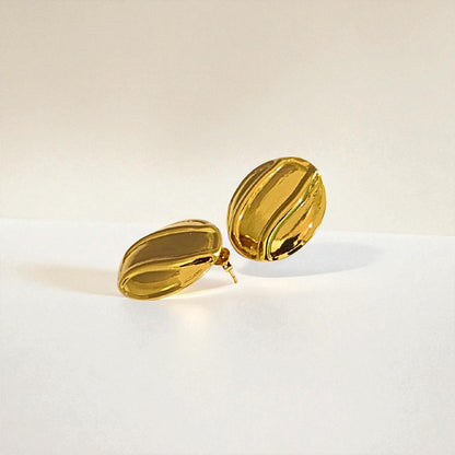 Gold Earrings for Women on a light beige background