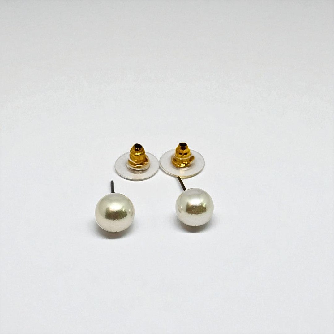 Pair of pearl earrings for women with gold posts on a white background