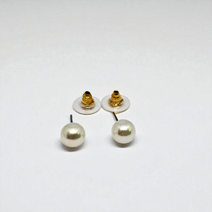 Pair of pearl earrings for women with gold posts on a white background