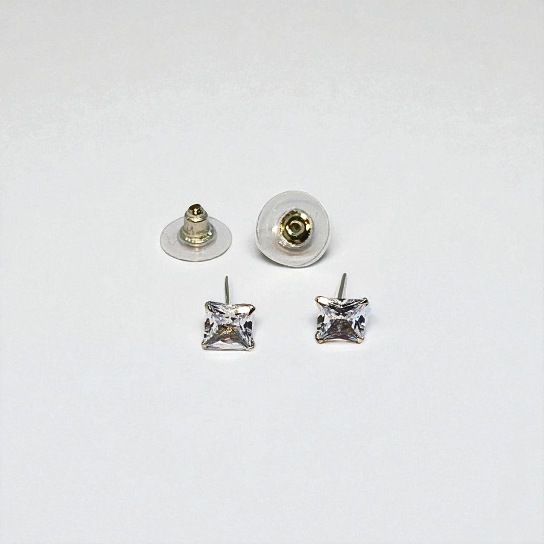 Pair of square crystal stud earrings for women with clear backs on a white background