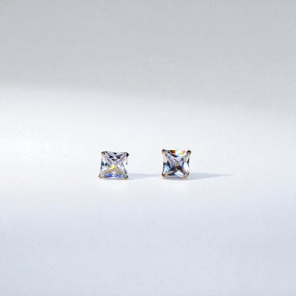 Two square-cut gemstones Studs Earrings for Women on a light gray background