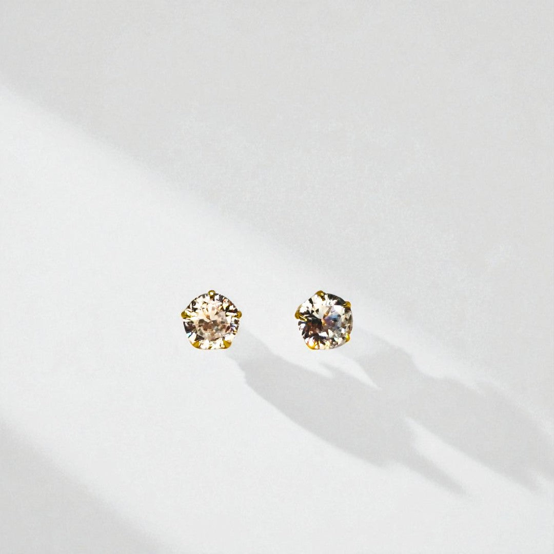 Pair of round crystal Stud Earrings for Women on a white background