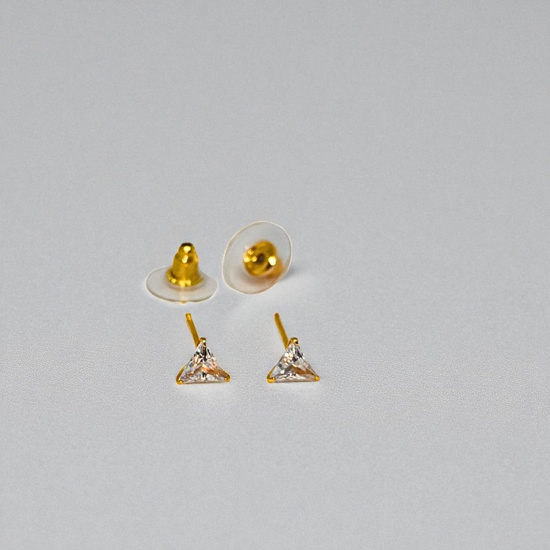 Gold triangle-shaped Stud Earrings for Women with clear stones on a gray background