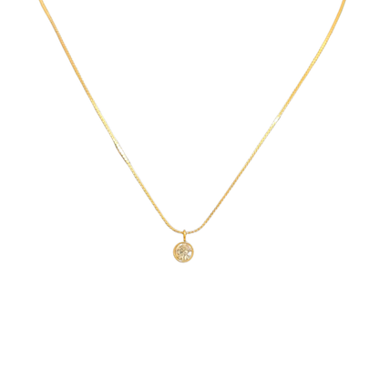 Gold necklace with a small round Pendant for Women on a white background