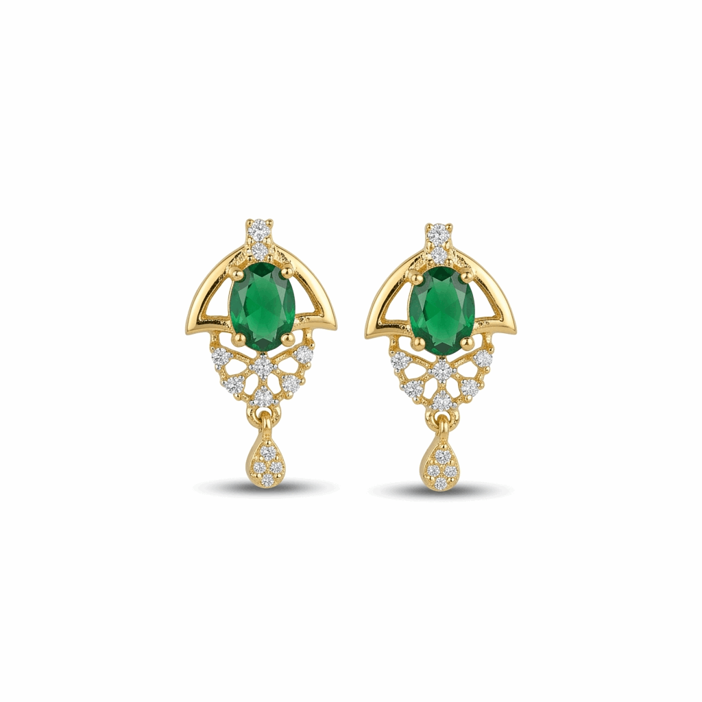 Gold earrings with green gemstones on a white background