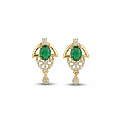 Gold earrings with green gemstones on a white background