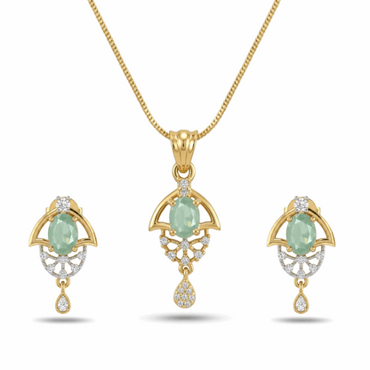 Gold jewelry set with green gemstones on a white background