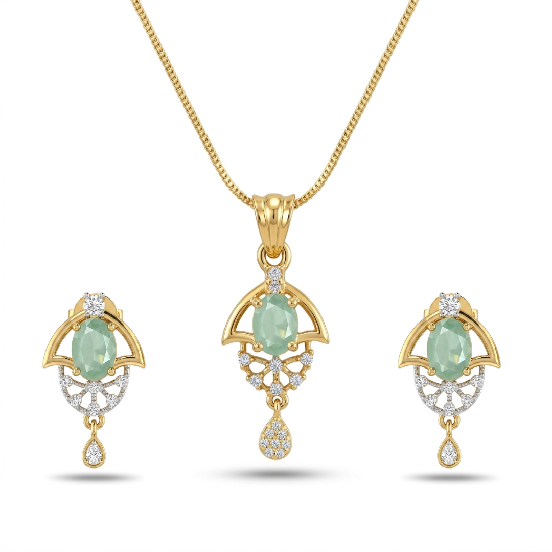 Gold jewelry set with green gemstones on a white background