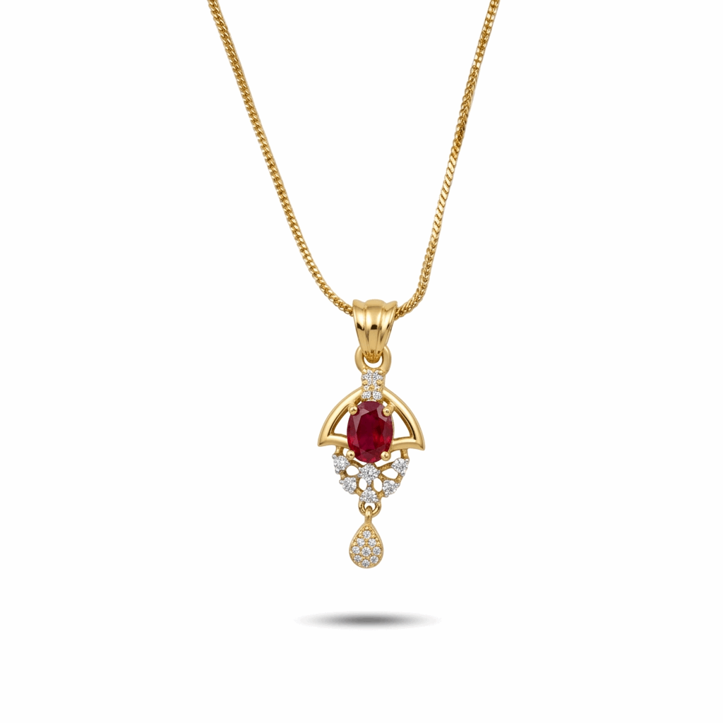 Gold pendant with a red gemstone on a white background