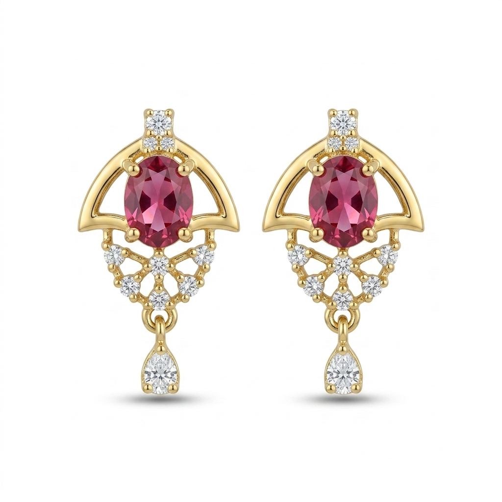 Gold earrings with red gemstones and diamond accents on a white background