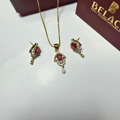 Jewelry set with necklace and earrings on a white surface, Belac brand visible.