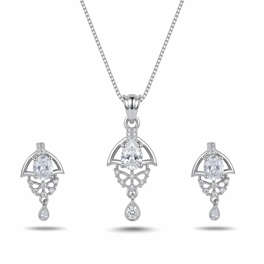 Silver jewelry set with pendant and earrings on a white background