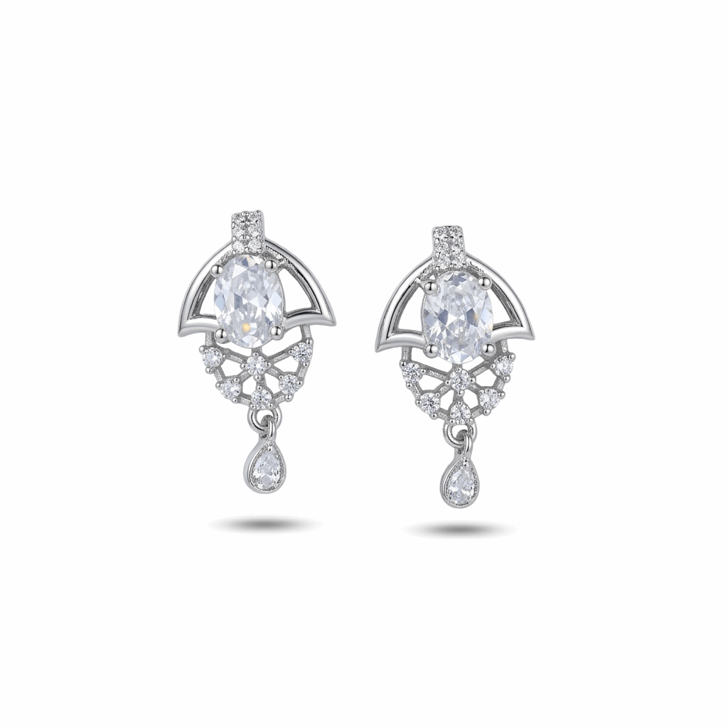 Pair of silver earrings with clear gemstones on a white background