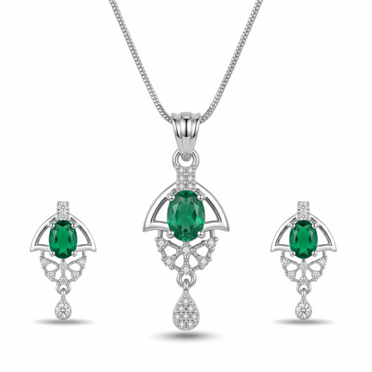 Jewelry set with emerald green gemstones and silver accents on a white background