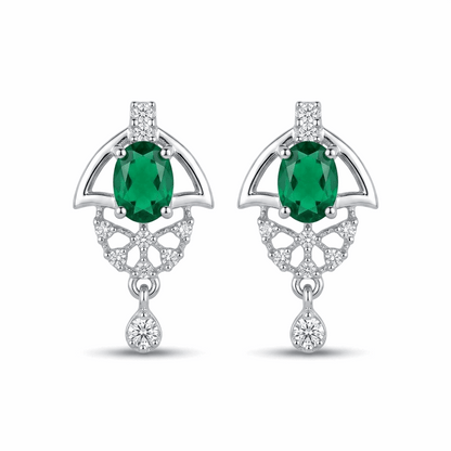 Pair of earrings with green gemstones and silver designs on a white background