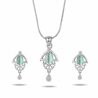Jewelry set with pendant and earrings featuring green stones on a white background