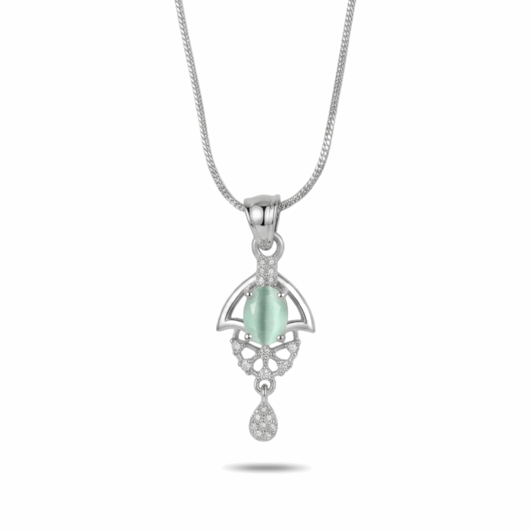 Silver pendant with a green gemstone on a white background
