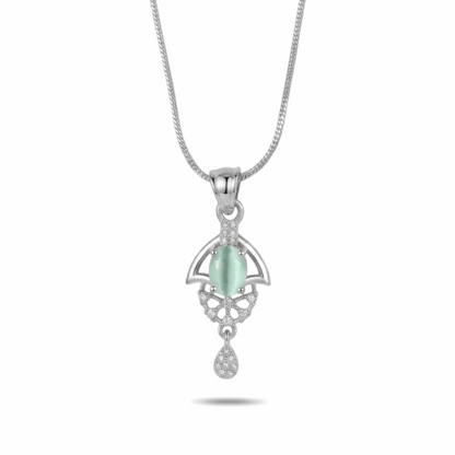 Silver pendant with a green gemstone on a white background
