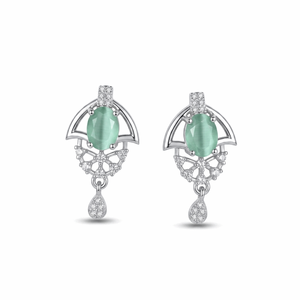 Pair of earrings with green gemstones and silver accents on a white background