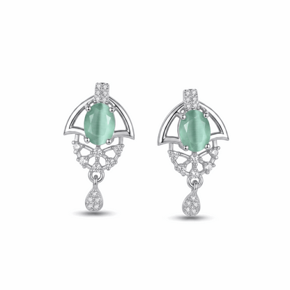 Pair of earrings with green gemstones and silver accents on a white background